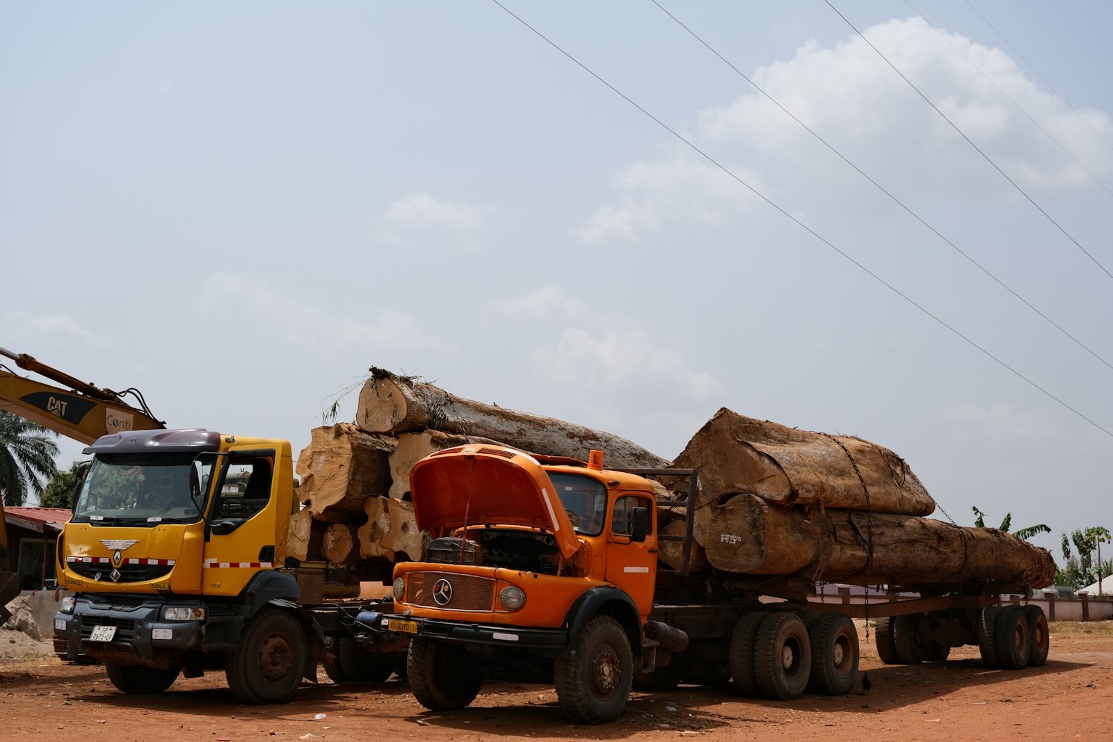 Cargo trucks on a dirt road